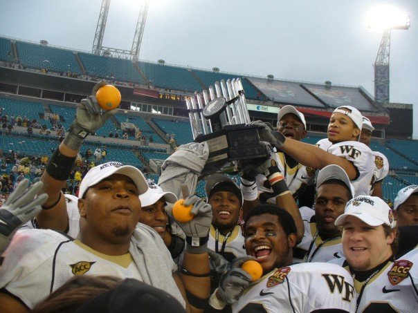 Boo Robinson (on left) and his teammates hold up oranges after winning the 2006 ACC Championship and getting an Orange Bowl berth.
