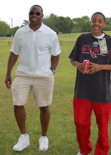 Tony Richardson, left, surprised Tyler Nelson at his 16th birthday party in May.