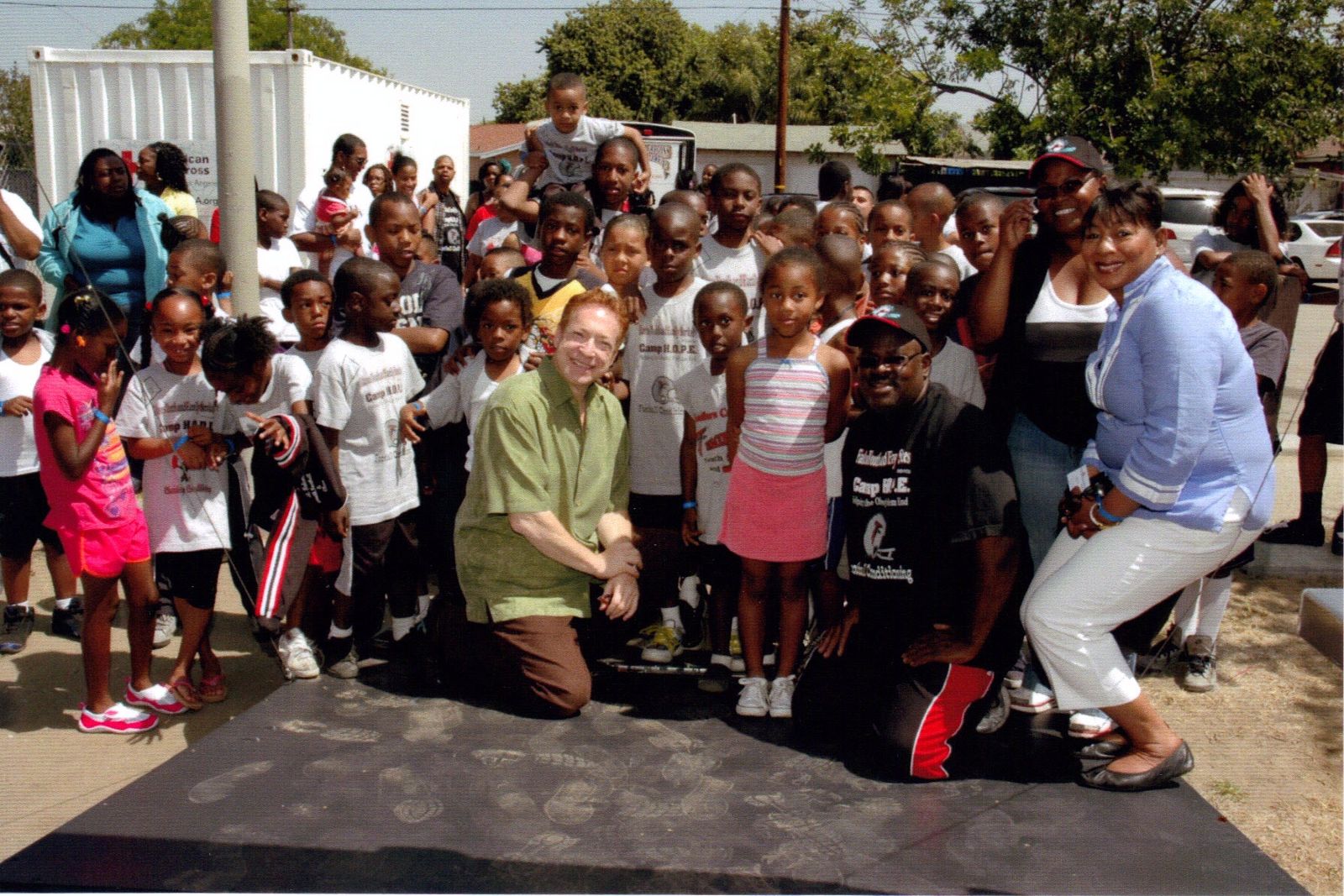 Falcons Youth and Family Services learning center with kids in the foreground.