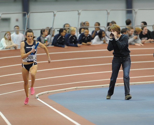 Beth Alford-Sullivan cheering on Big Ten Champion sprinter Fawn Dorr.